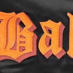 CHAMARRA TIMORE ORIOLES OLD ENGLISH RIB SATIN JACKET BLACK ORANGE en STOCK