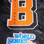 CHAMARRA IMORE ORIOLES MASH UP RIB SATIN JACKET BLACK ORANGE en STOCK